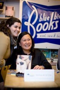 Melissa de la Cruz with a fan