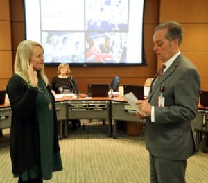 Dr. Crissie Stapleton (left) is sworn in as State Board of Education (SBE) chair by outgoing SBE chair Alan Walters (right) during the December 13, 2022 SBE meeting